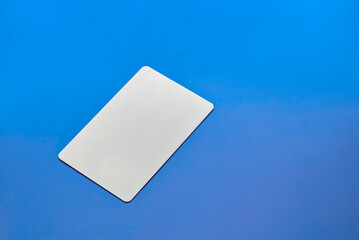 plastic hotel keycard islated on solid color background (rectangular access key card) blue