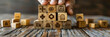  A Hand Arranged Wood Block Stacking with the Hea,
Business concept on grungy grey table side view. hand holding wooden blocks with icon