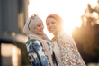 © Santi Nuñez/Stocksy - Portrait of happy muslim women friends