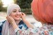 © Santi Nuñez/Stocksy - Portrait of glad muslim women friends having fun