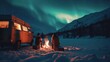 Campfire with vintage camper van in campsite with beautiful aurora northern lights in night sky with snow forest in winter.