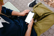 © DZ FILM/Stocksy - A man uses a mobile phone with a white screen
