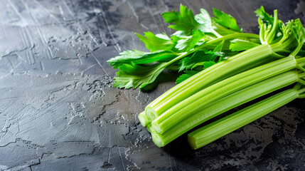 Wall Mural - celery stalks on the table. Selective focus.