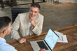 © insta_photos - Professional advisor consulting business man investor explaining financial trade stock market trends in crypto exchange investing planning using laptop computer at office meeting. Copy space.
