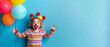 happy blond kid with colourfull pom poms in his hair on blue background