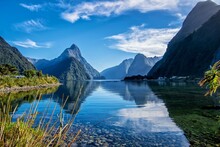 Mountains Reflected In The Lake In Milford Sound