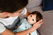 © Maria Manco/Stocksy - little girl holds baby doll