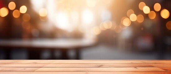 Wall Mural - A hardwood table dominates the foreground with a blurry natural landscape in the background. The warm shades of wood and peach add a cozy feel to the macro photography scene