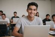 © kotlyarn - Studious young man in a classroom with other students, focused on his laptop and engaged in his education.