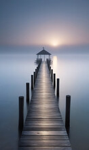 The Wooden Dock Goes Into The Lake In A Foggy Morning Photo