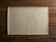 crumpled parchment old worn paper page with yellowing edges on wooden table background texture with copyspace