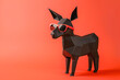 © ADDICTIVE STOCK - Geometric paper dog with sunglasses on orange backdrop. Generative AI image