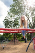 © Bethany Birnie/Stocksy - Sitting on the monkeybars