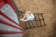 © Bethany Birnie/Stocksy - Climbing on playground