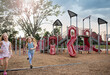© Bethany Birnie/Stocksy - Play racing at the playground