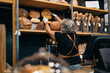© Santi Nuñez/Stocksy - Bakery Worker Holding Bread