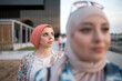 © Santi Nuñez/Stocksy - Muslim women friends in the street
