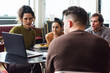 © Ana Luz Crespi/Stocksy - Worry: People looking at screen in staff meeting