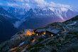 © Alina Miluseva/Stocksy - Mountain refuge with view of Mont Blanc massif at dusk
