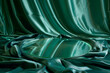 luxurious green silk cloth drapery with a smooth reflective glass plate centered