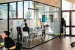 © Studio Marmellata/Stocksy - Group of colleagues discussing in meeting room