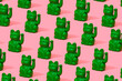 © Juan Moyano/Stocksy - pattern of green chinese lucky cats