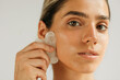 © Studio Firma/Stocksy - Woman Massaging Face
