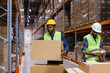 © Oleksii Syrotkin/Stocksy - Workers stacking boxes