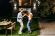 © DZ FILM/Stocksy - Man and woman dancing in the backyard