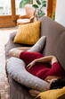 © Mauro Grigollo/Stocksy - A pregnant woman sleeping on the sofa in the afternoon at home
