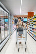 © Alvaro Lavin/Stocksy - Woman at the grocery store.