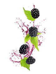 Wall Mural - Fresh blackberries and juice in air on white background