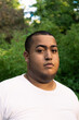 © Adrian Rodd/Stocksy - Portrait of plus size black boy