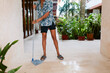 © ByLorena/Stocksy - Moping Floor in Tropical Hotel