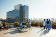 © BONNINSTUDIO/Stocksy - Diverse medical team taking a break on hospital terrace