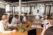 © Camelia Elisabeta Utalea/Stocksy - group leader with her employees in a coworking office