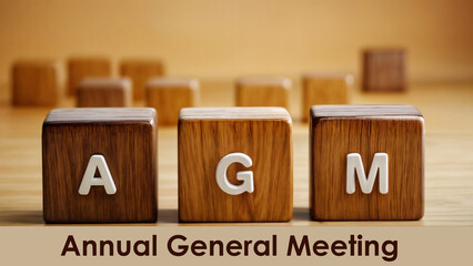 Wooden cube blocks of AGM word text annual General Meeting