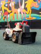 The loadeThe loader vehicle toy for kids sit on the playground.r vehicle toy.