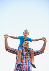 Poster - Father, young boy and shoulders of parents, sky and outdoors in park with smile. Laugh, love or bonding for son and dad with family, spring and carrying his child in summer and spending time together