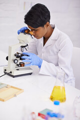 Doctor, microscope and scientist in laboratory for equipment, experiment and innovation. Science, technology and researcher or woman with medical research for sample analysis and bacteria testing