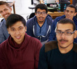 © ArcursJointTeam/peopleimages.com - Group, surprise and portrait of men together watching sports match in university library. Fans, diversity and young male students streaming a football game together with shock in college dorm.