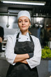 © DZ FILM/Stocksy - Portrait of a smiling chef