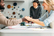 © Studio Firma/Stocksy - Business partners shaking hands