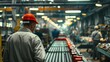 A group of men are engaged in mass production on a conveyor belt in a factory,