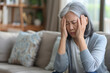 © ZAY WIN HTAI - Dizziness or headache of Asian senior woman.