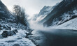 foggy winter landscape with mountains in the background and a small river in the foreground