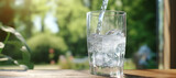 Fototapeta Łazienka - fresh clear mineral water in a glass 55