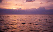 Purple sunset sky on ocean, Scenic sea sunset over calm water surface