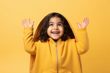 Canvas Print - ute little girl child raised hand and giving happy expression