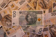 two bundles of money - 200 and 100 PLN
